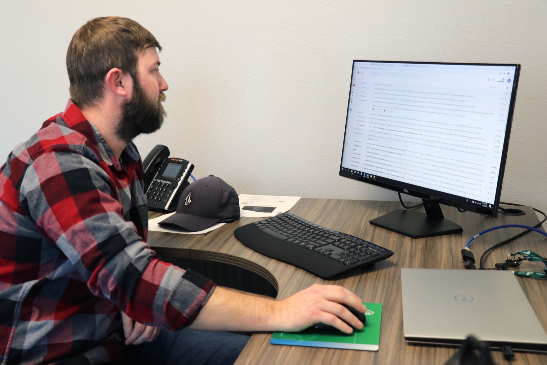 Maptek - Cameron Baker at his desk